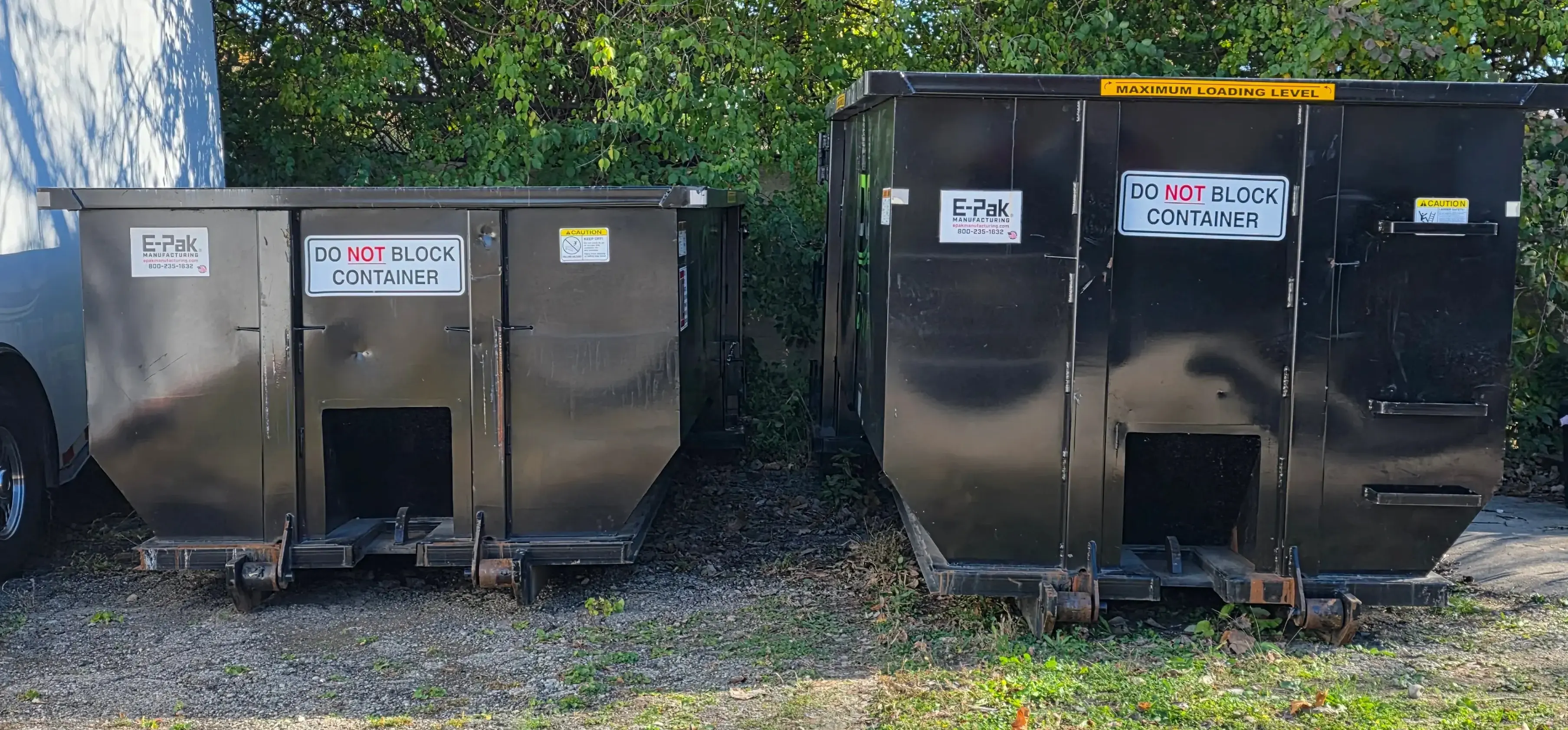 Side-by-side comparison of ODS 15-yard and 20-yard roll-off dumpsters